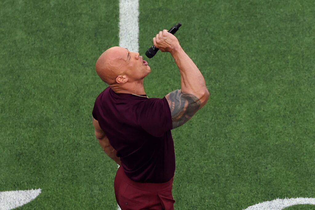 Dwayne The Rock Johnson, Actora and WWE legend, introducing both teams before the game starts. Gregory Shamus Getty Images