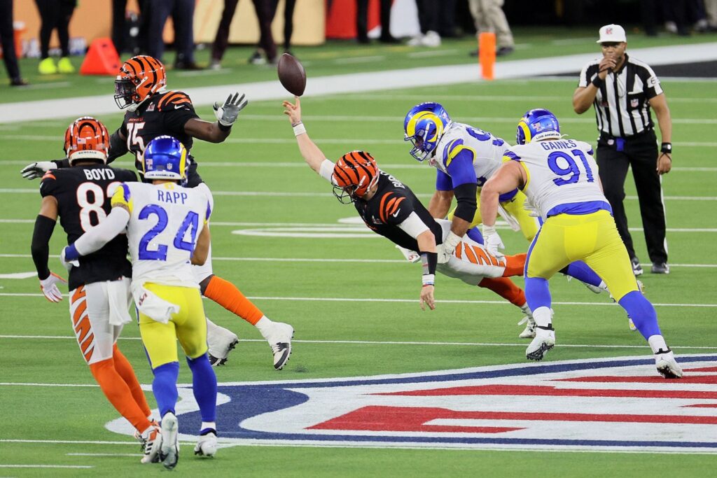 Joe Burrow, the Bengals quarterback is trying to catch the ball as Aaron Donald could be also seen. The rams took the possession. Andy Lyons Getty Images