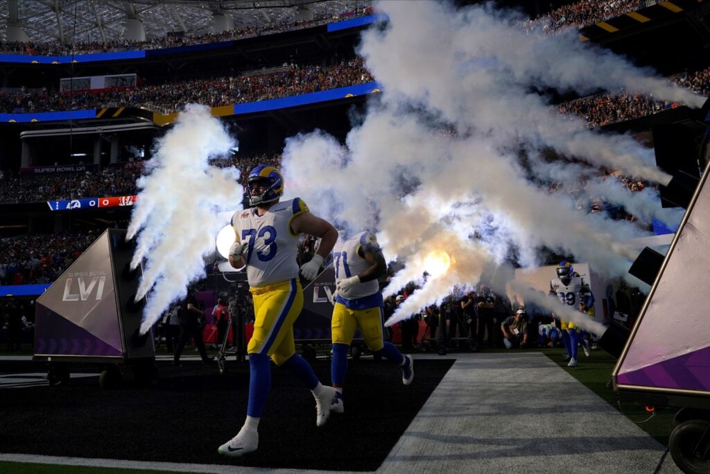 Rams running in the field before the game starts. Marcio Jose Sanchez AP